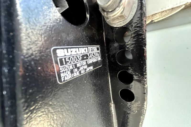 Slide: The Image of Close-up of a Suzuki motor label on a Savannah 210X, 2025 model. - 64