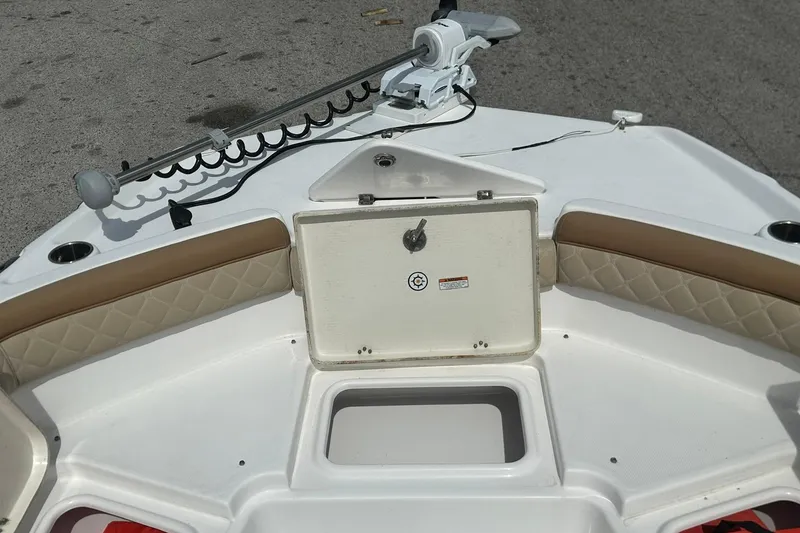 Slide: The Image of 2024 NauticStar 211 Hybrid boat interior with storage compartment and seating. - 13
