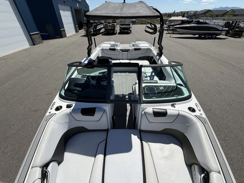 Slide: The Image of 2018 Nautique Super Air Nautique GS22 boat on parking lot. - 10