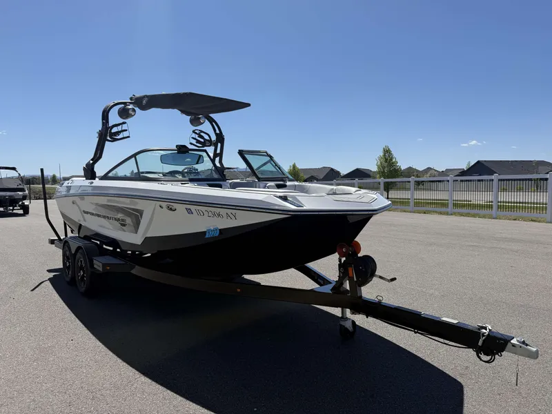Slide: The Image of 2018 Nautique Super Air Nautique GS22 on trailer, sunny day. - 4