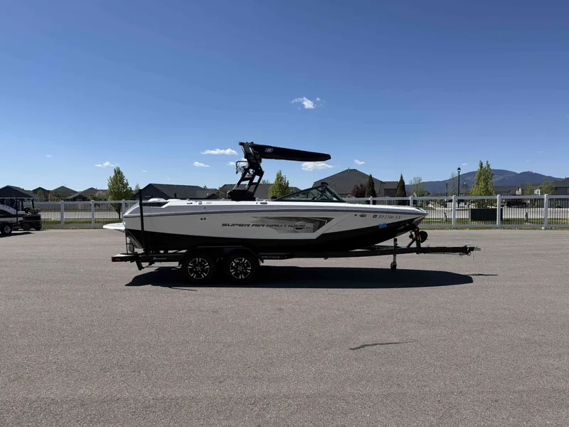 Slide: The Image of 2018 Nautique Super Air Nautique GS22 on trailer, sunny day. - 5