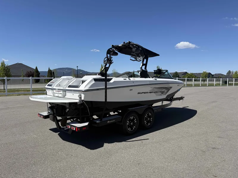 Slide: The Image of 2018 Nautique Super Air Nautique GS22 on trailer, sunny day. - 6
