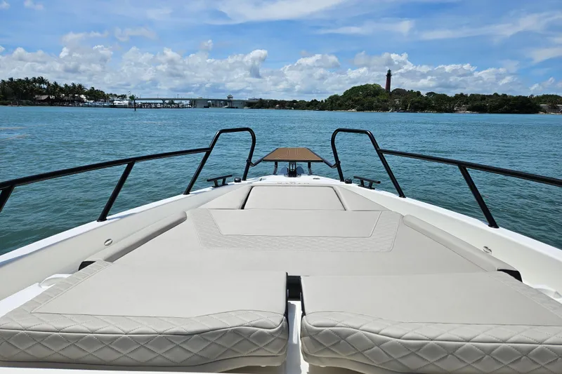 Slide: The Image of Navan S30 boat 2026 on calm waters with blue sky. - 12