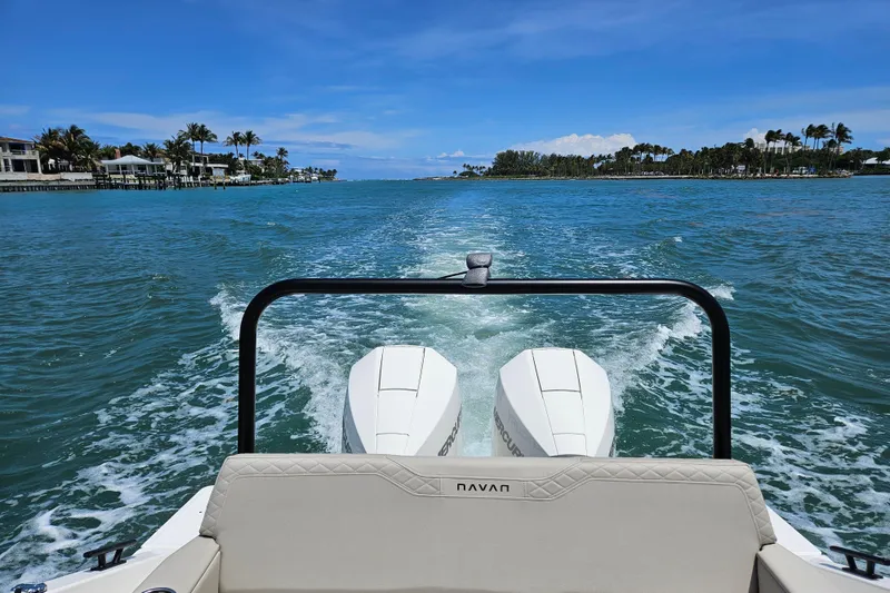 Slide: The Image of Navan S30 boat 2026 on blue water with palm trees in background. - 13