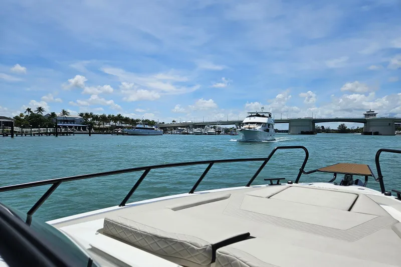 Slide: The Image of Navan S30 Yacht 2026 on calm waters with bridge in background. - 14