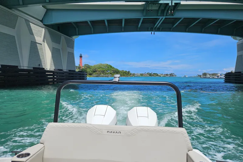 Slide: The Image of Navan S30 boat under bridge with lighthouse in background, 2026. - 15