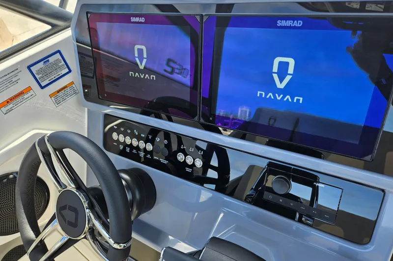 Slide: The Image of Navan S30 2026 boat console with Simrad screens and controls. - 20
