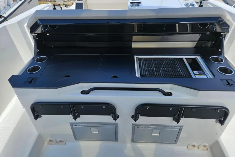 Slide: The Image of Navan S30 2026 boat kitchen with grill and storage. - 23