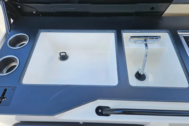 Slide: The Image of Navan S30 2026: Modern sink with faucet and cup holders. - 24