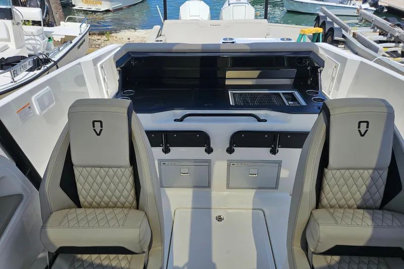 Slide: The Image of Interior of Navan S30 boat, 2026 model, featuring modern seats and control console. - 25