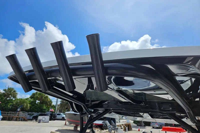 Slide: The Image of Navan S30 2026 with four black exhaust pipes under blue sky. - 33