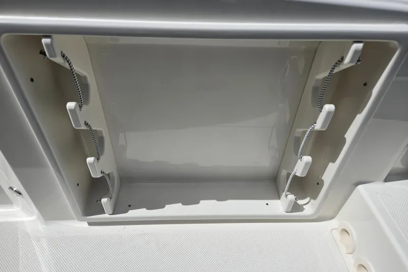Slide: The Image of Navan S30 2026 storage compartment with holders and cables. - 34