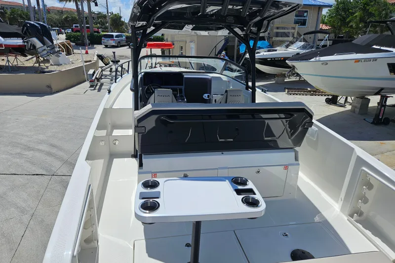 Slide: The Image of Interior view of Navan S30 boat, 2026 model, featuring table and cup holders. - 4