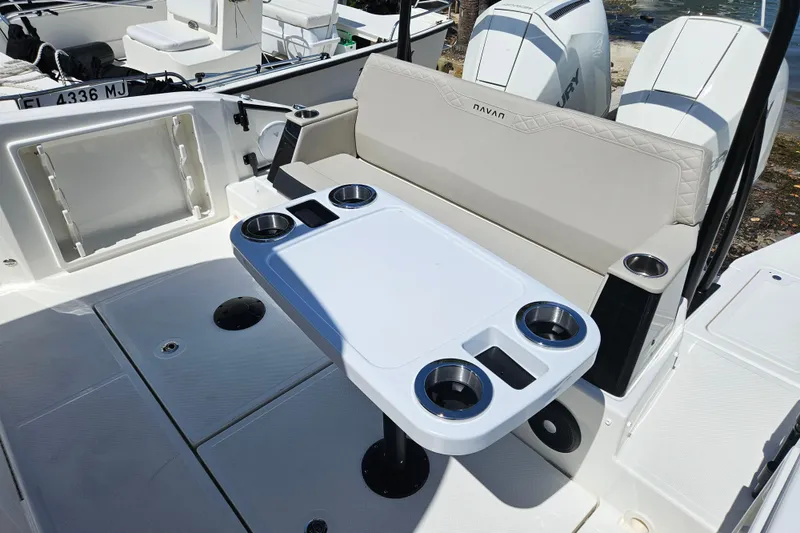 Slide: The Image of Navan S30 boat 2026 with seating and table featuring cup holders. - 5