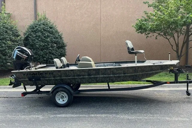 The Image of 2026 Tracker Grizzly 1754 SC boat on trailer, parked outdoors. - 0
