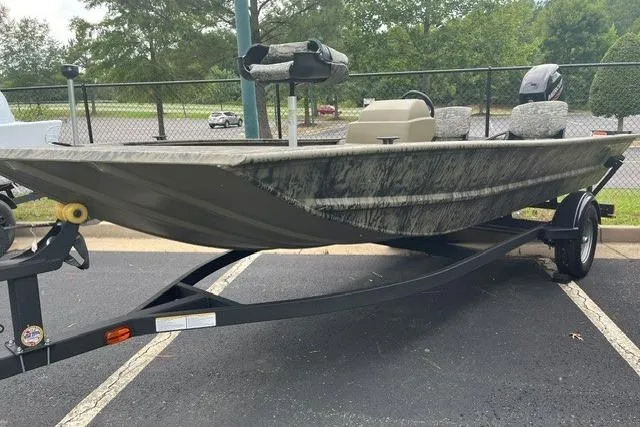 The Image of 2026 Tracker Grizzly 1754 SC boat on trailer in parking lot. - 0