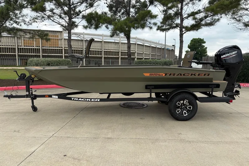 The Image of 2026 Tracker Grizzly 1756 T Marsh boat on trailer, parked outdoors. - 0
