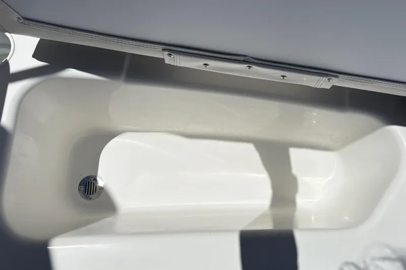 Slide: The Image of Interior view of a 2026 Tahoe T16 boat compartment with drain. - 32