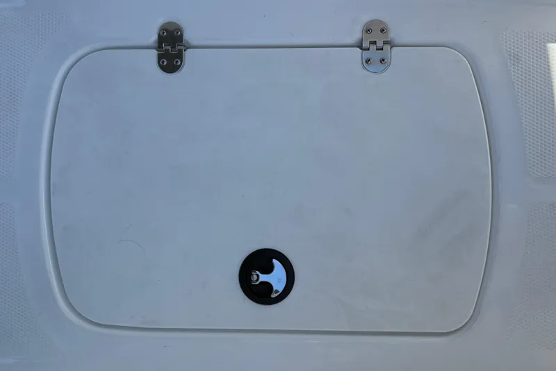 Slide: The Image of Hinged compartment door on 2026 Tahoe T16 boat, featuring a circular latch. - 34