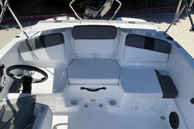 Slide: The Image of 2026 Tahoe T16 boat interior with seating and steering wheel, showcasing modern design. - 15