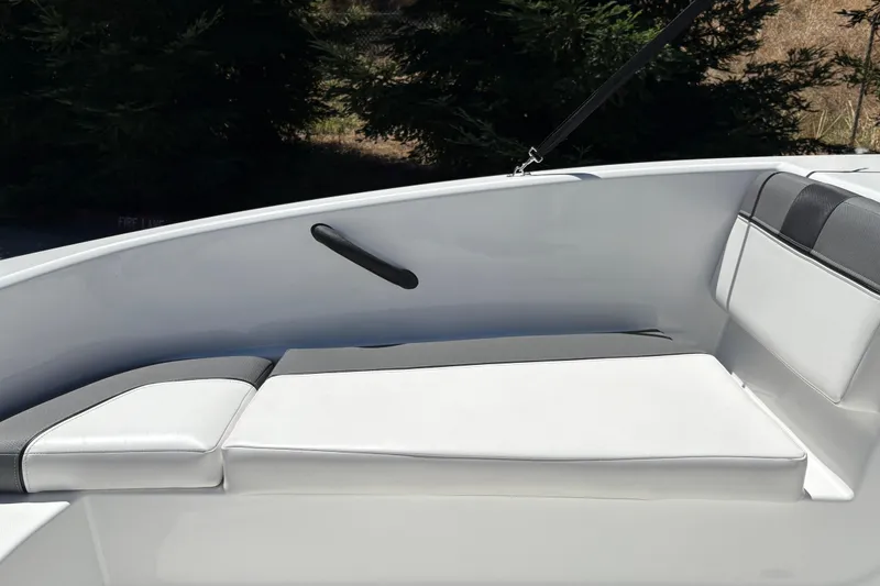Slide: The Image of 2026 Tahoe T16 boat interior with white cushioned seating and sleek design. - 28