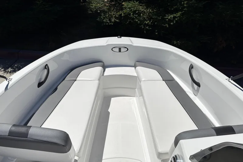 Slide: The Image of 2026 Tahoe T16 boat interior with sleek white seating and modern design. - 12