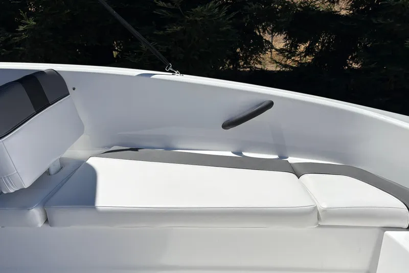Slide: The Image of 2026 Tahoe T16 boat interior with white cushioned seating and sleek design. - 33