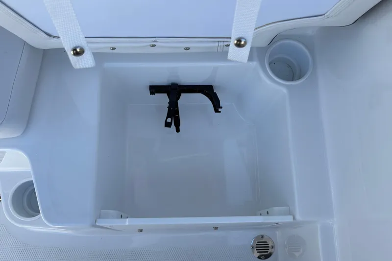 Slide: The Image of Storage compartment in 2026 Tahoe T16 boat with cup holders and drainage. - 24