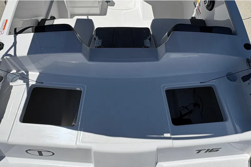 Slide: The Image of 2026 Tahoe T16 boat interior with storage compartments and seating area. - 19