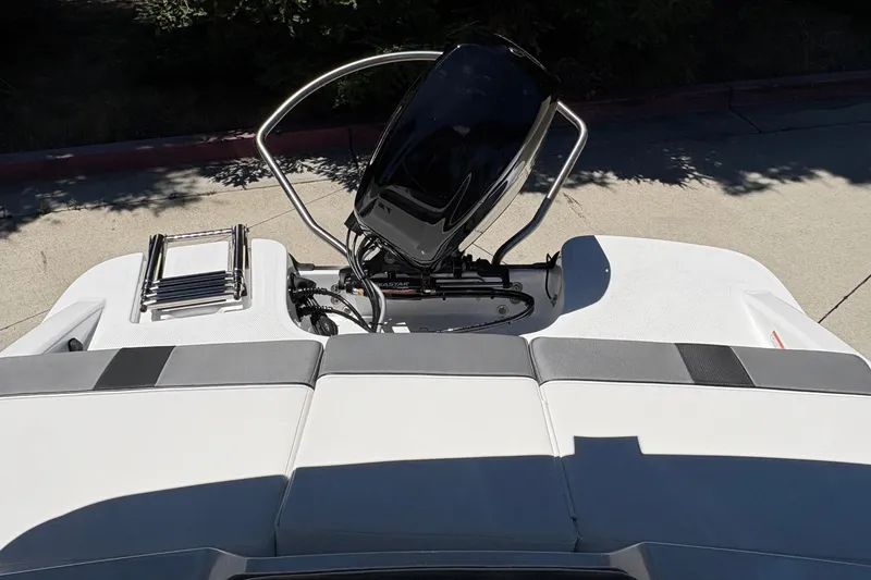 Slide: The Image of Rear view of 2026 Tahoe T16 boat with motor and swim platform. - 18