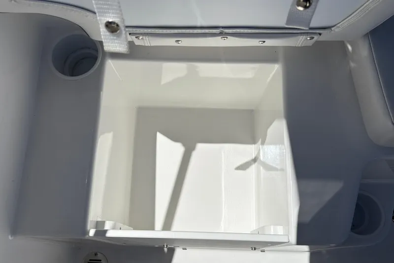 Slide: The Image of Storage compartment of 2026 Tahoe T16 boat, featuring a clean, white interior design. - 22