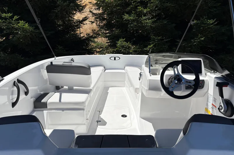 Slide: The Image of 2026 Tahoe T16 boat interior with sleek seating and modern steering console. - 13
