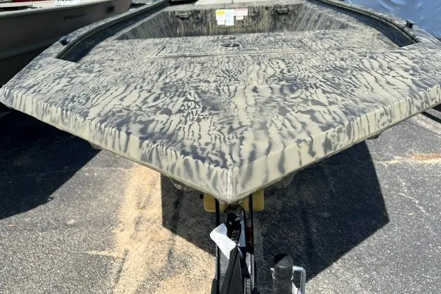Slide: The Image of 2026 Tracker Grizzly 1648 Utility boat with camouflage pattern on a trailer. - 2