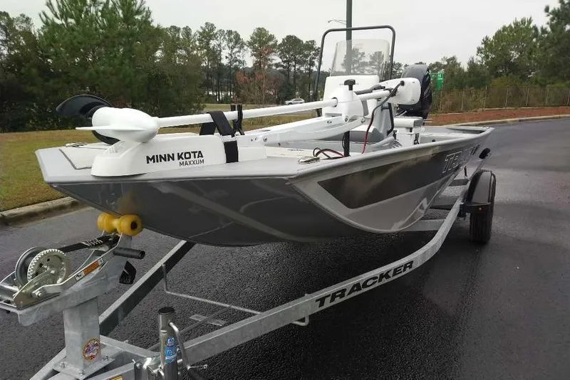 Slide: The Image of 2026 Tracker Bass Tracker Classic CC boat on trailer with Minn Kota Maxxum motor. - 2