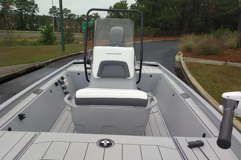 Slide: The Image of 2026 Tracker Bass Tracker Classic CC boat interior with seating and steering console. - 6