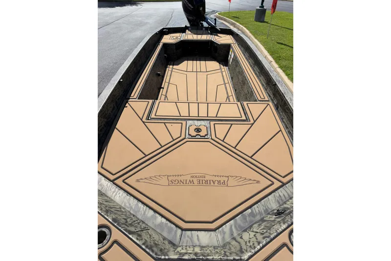 Slide: The Image of 2026 Tracker Grizzly 1650 T Prairie Wings Edition boat with custom deck design. - 15