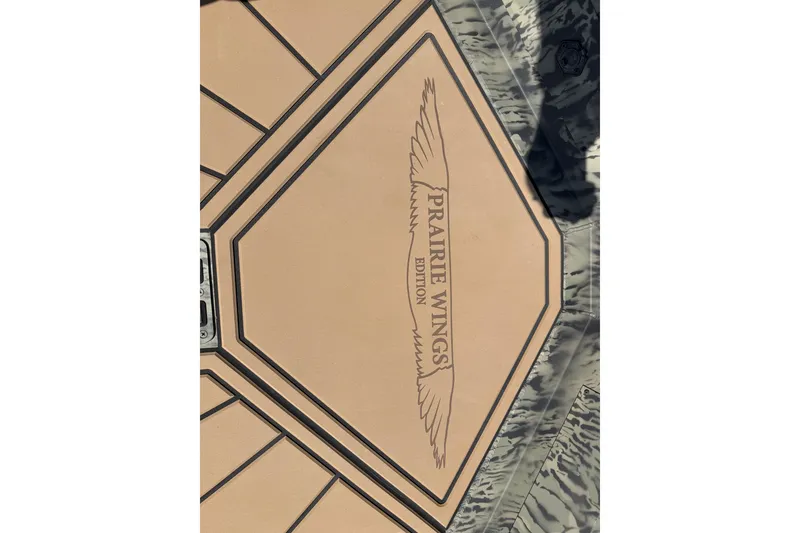 Slide: The Image of 2026 Tracker Grizzly 1650 T Prairie Wings Edition logo on textured surface. - 7