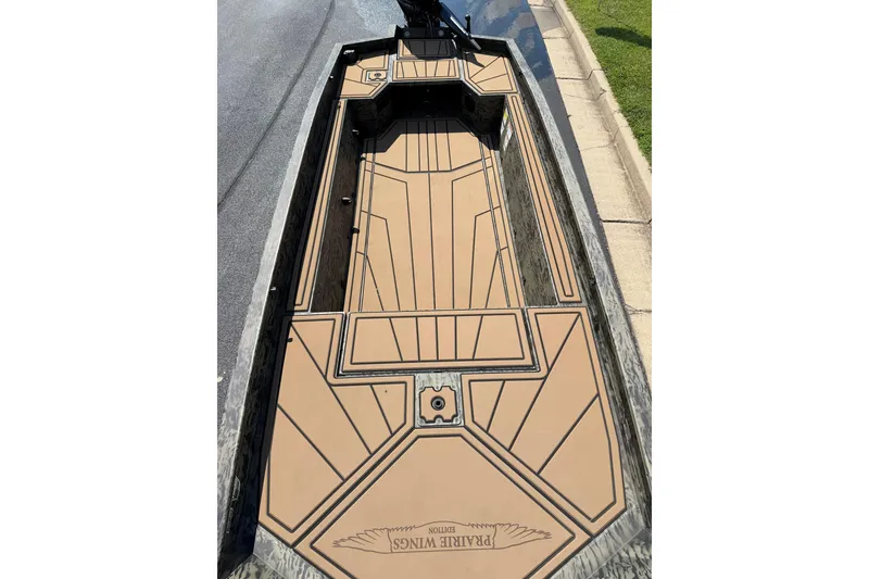 Slide: The Image of 2026 Tracker Grizzly 1650 T Prairie Wings Edition boat interior with custom flooring design. - 6