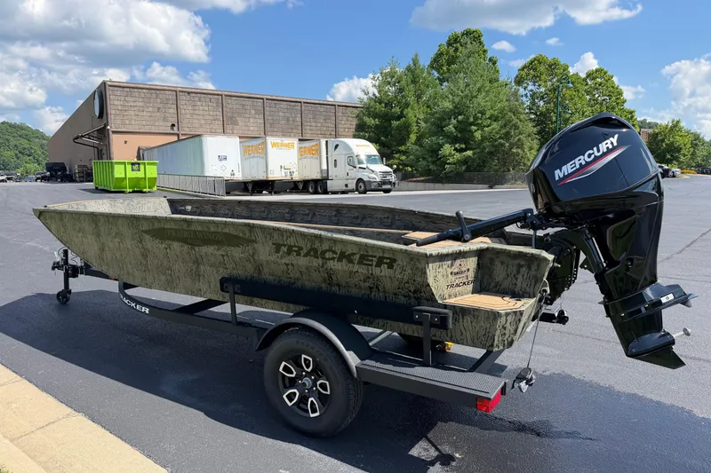 Slide: The Image of 2026 Tracker Grizzly 1650 T Prairie Wings Edition boat with Mercury engine on trailer. - 5