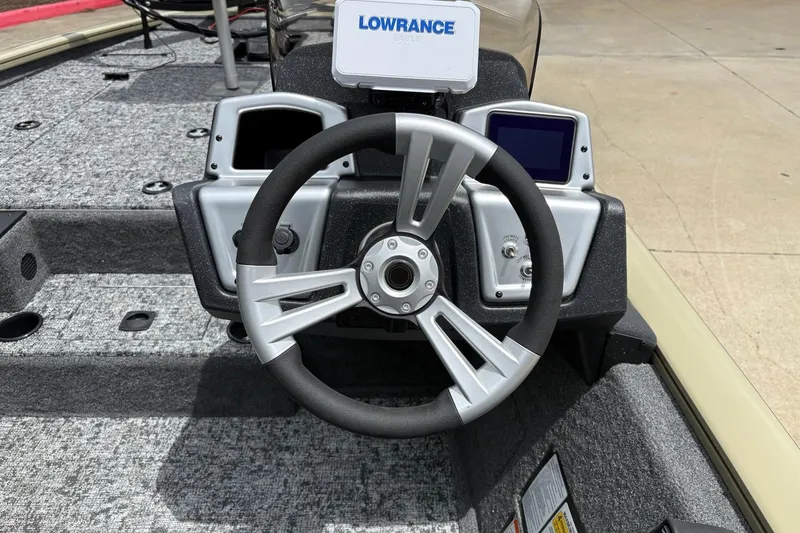 Slide: The Image of Steering wheel of 2026 Tracker Pro Team 195 boat with Lowrance electronics. - 5