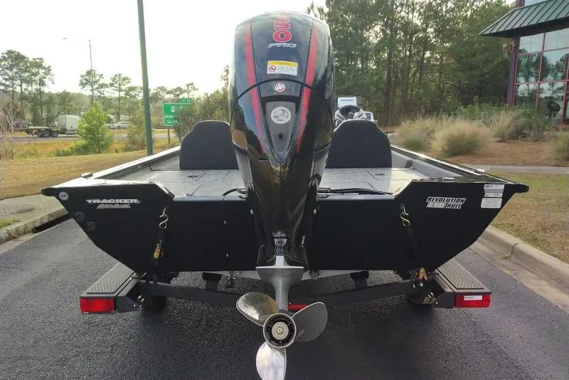 Slide: The Image of 2026 Tracker Pro Team 195 boat with powerful outboard motor, parked on a trailer. - 5
