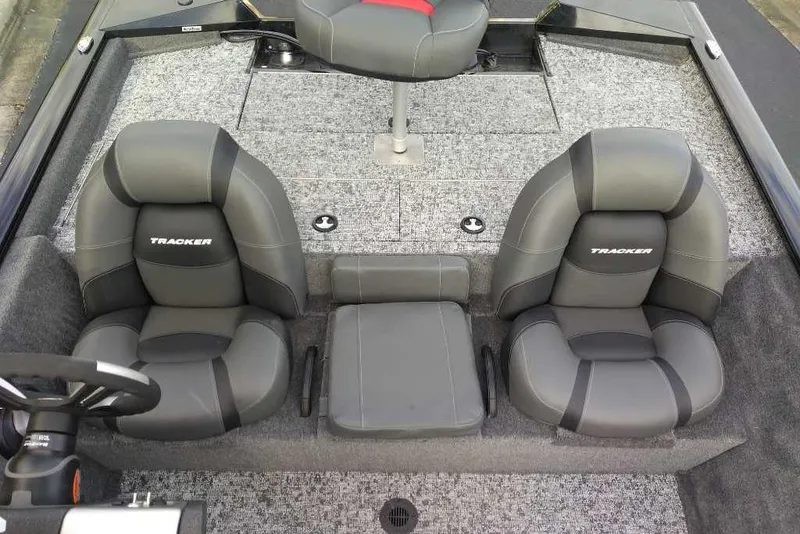 Slide: The Image of 2026 Tracker Pro Team 195 boat interior with gray seating and steering wheel. - 60