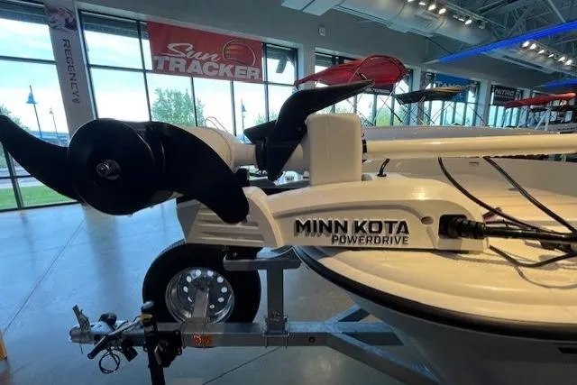 Slide: The Image of 2026 Mako Pro Skiff 15 CC with Minn Kota PowerDrive motor in showroom. - 2