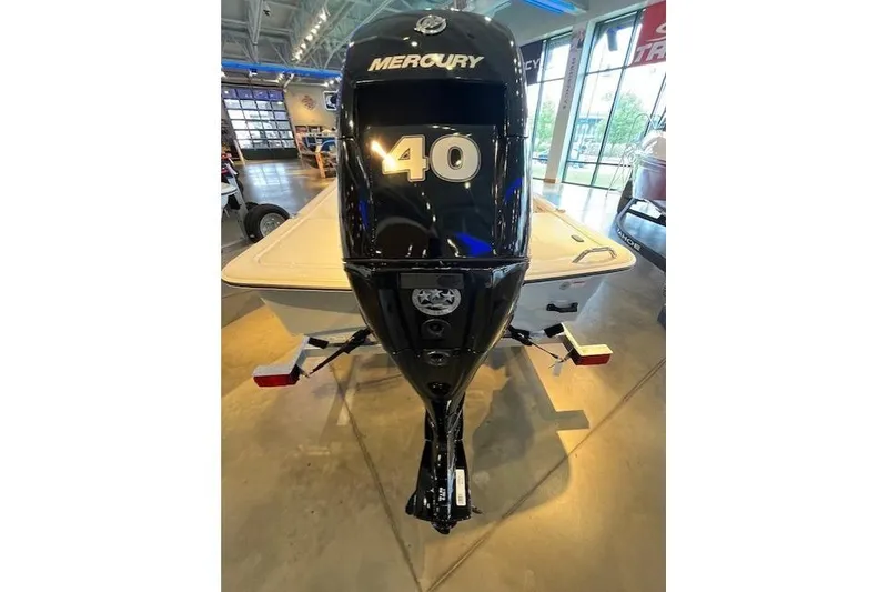 Slide: The Image of 2026 Mako Pro Skiff 15 CC with Mercury 40 outboard motor in showroom. - 4