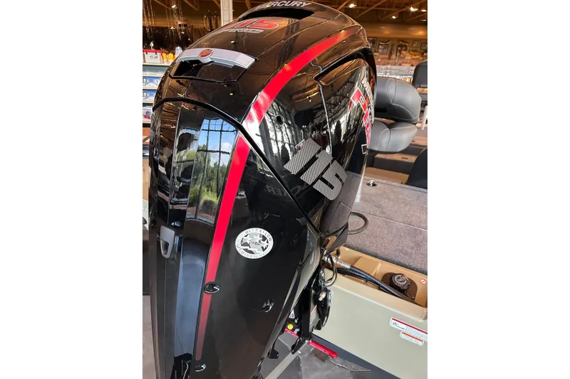 Slide: The Image of 2026 Tracker Pro Team 190 boat with Mercury 115 outboard motor in showroom. - 3