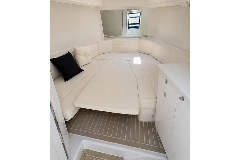 Slide: The Image of Interior of 2016 VanDutch 40 yacht with white seating and cushions. - 10