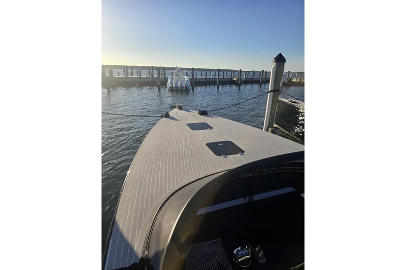 Slide: The Image of 2016 VanDutch 40 yacht docked at marina, sunlit deck, calm waters. - 3
