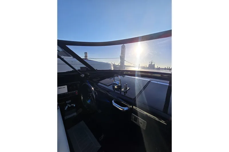 Slide: The Image of Cockpit view of 2016 VanDutch 40 yacht with city skyline and sunset. - 8