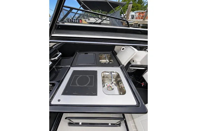 Slide: The Image of 2016 VanDutch 40 yacht kitchen area with sleek sink and stove design. - 9