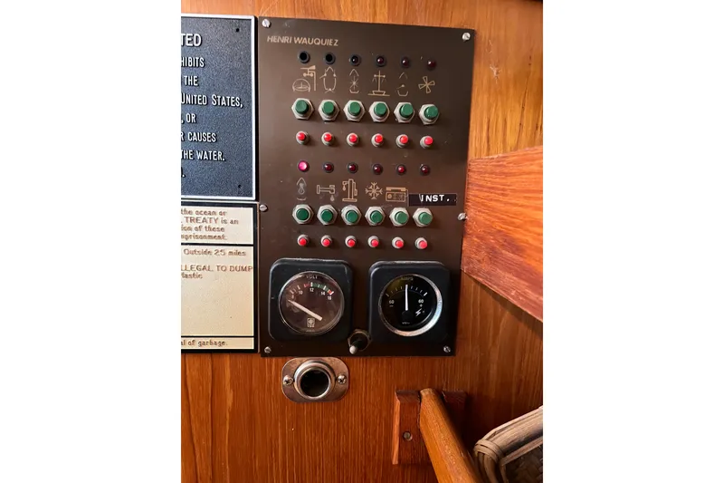 Slide: The Image of Control panel of a 1986 Wauquiez Petorine sailboat with gauges and switches. - 17